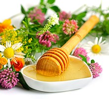 flowers and honey on a white background